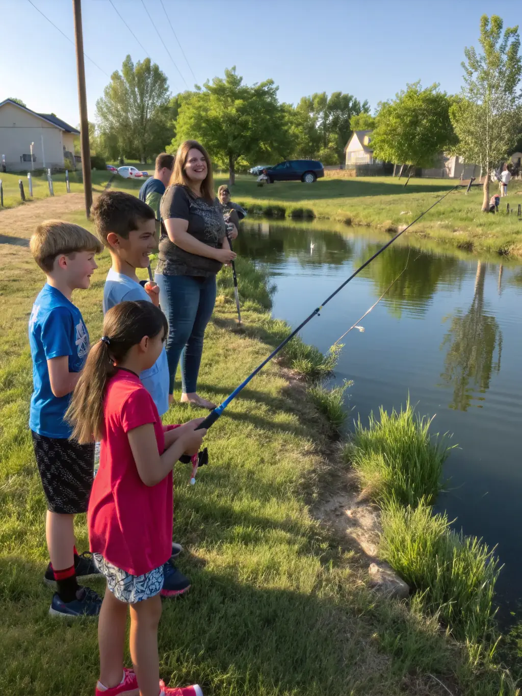 A photograph showcasing participants of all ages enjoying a community fishing day at a local pond, with families laughing and sharing their fishing experiences.